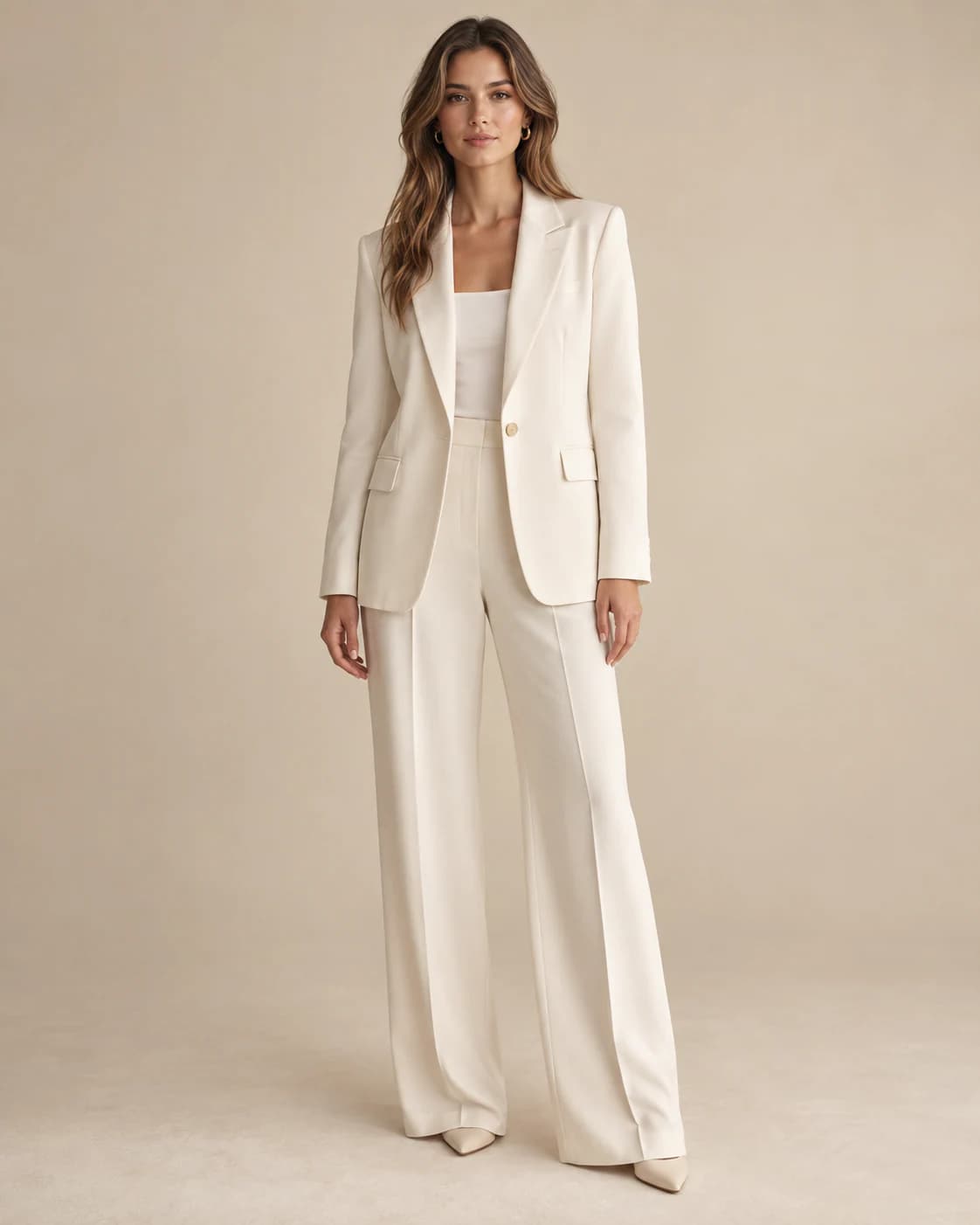 Celestine Tailored Co-ord in cream crepe, front view on a plain champagne background