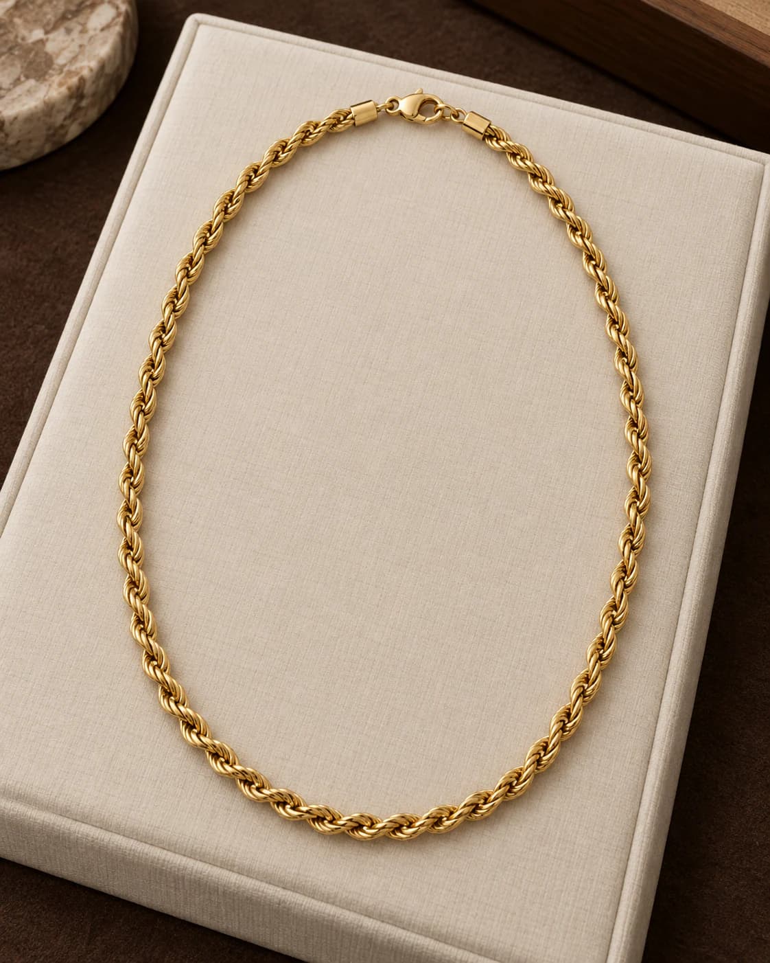 18ct Gold Rope Chain, 4mm in 18ct yellow gold, front view on a plain champagne background