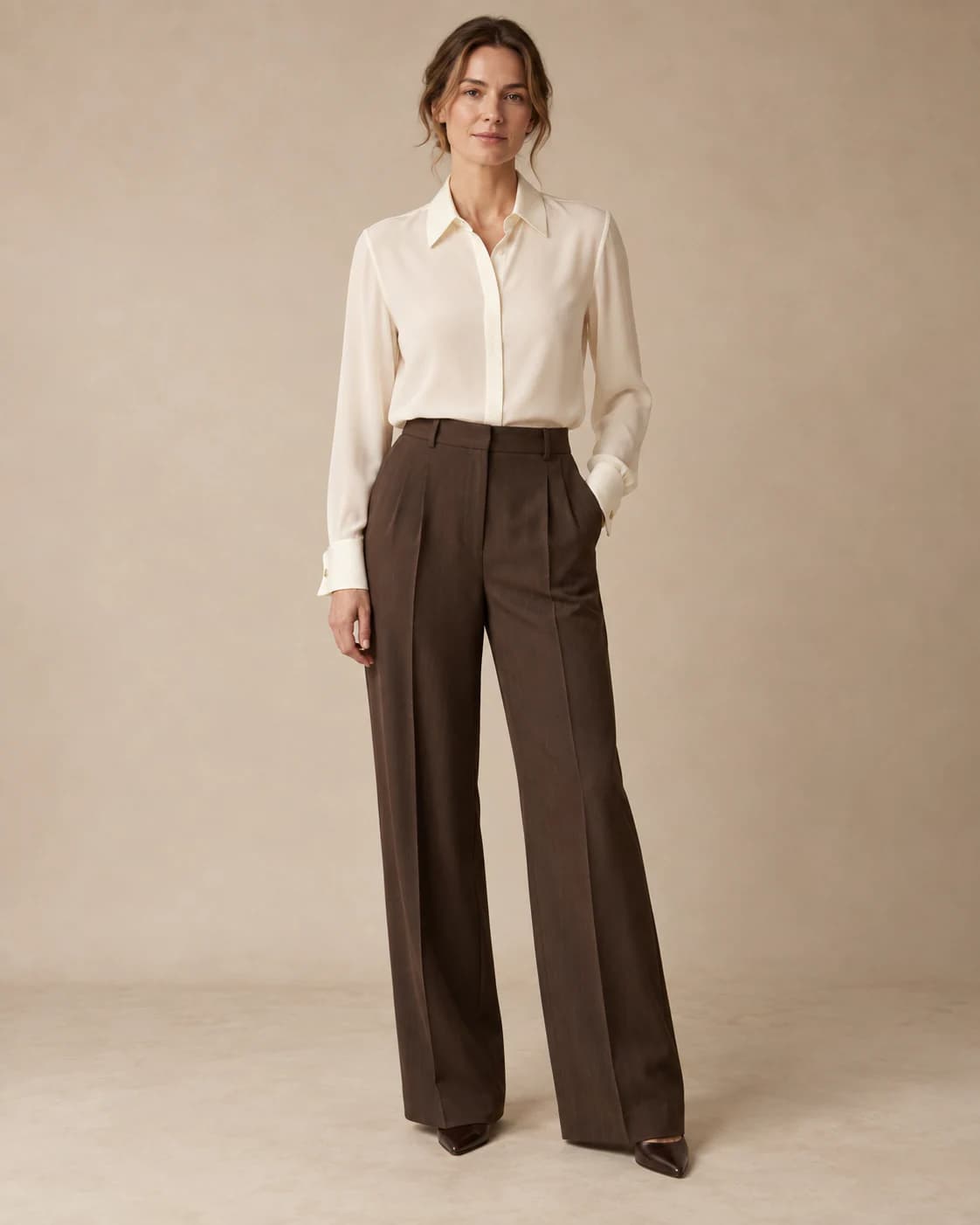 Isolde Silk Blouse in ivory silk, front view on a plain champagne background