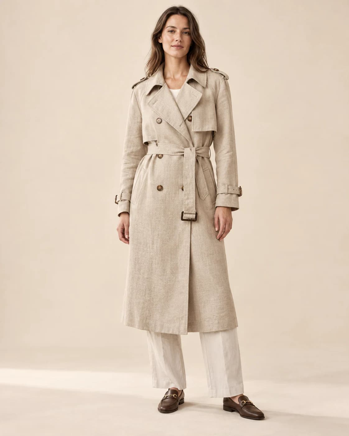 Marguerite Linen Trench in stone linen, front view on a plain champagne background